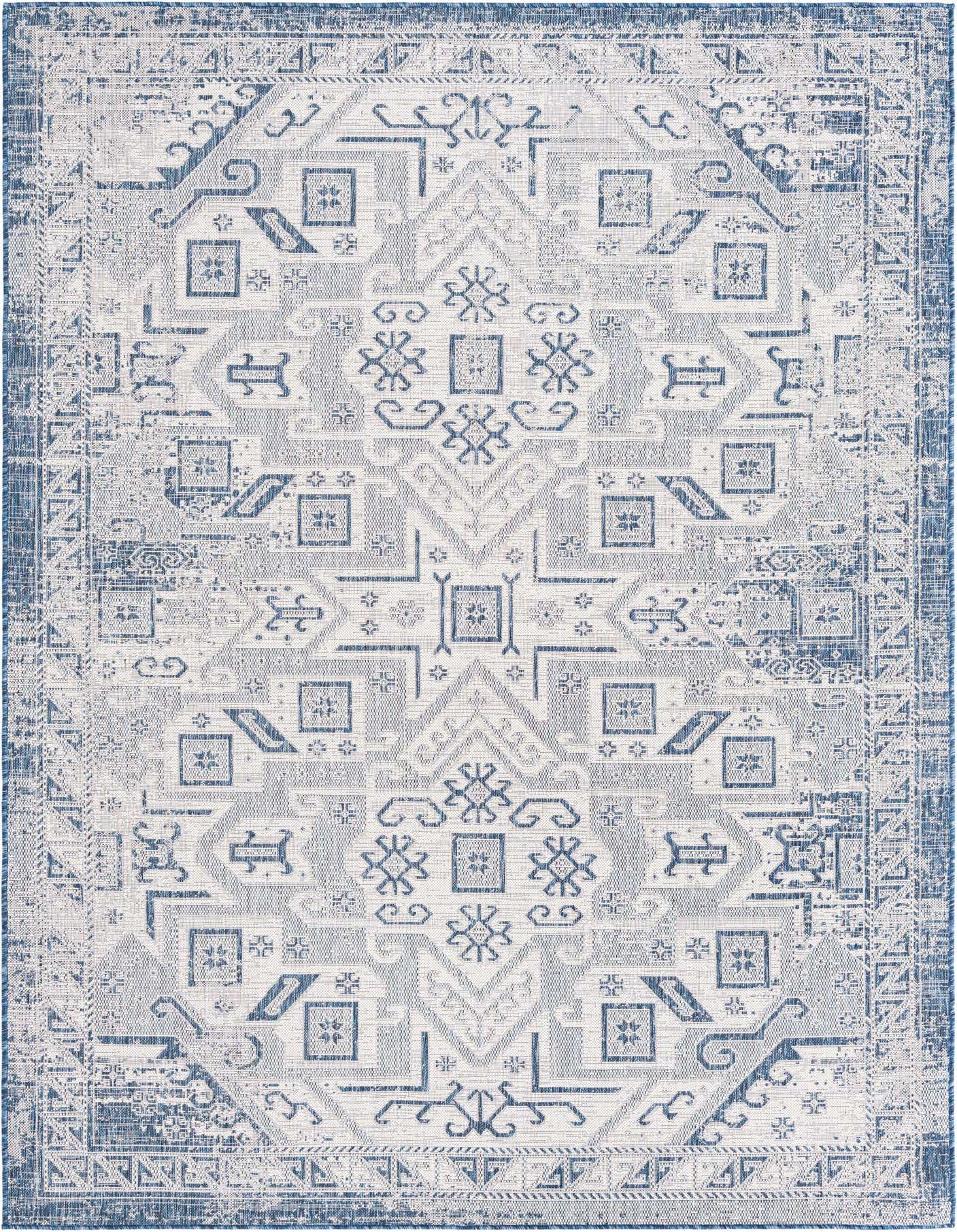 A 7x10 rectangular blue and white Southwestern rug with a distressed tribal pattern, suitable for indoor or outdoor use.