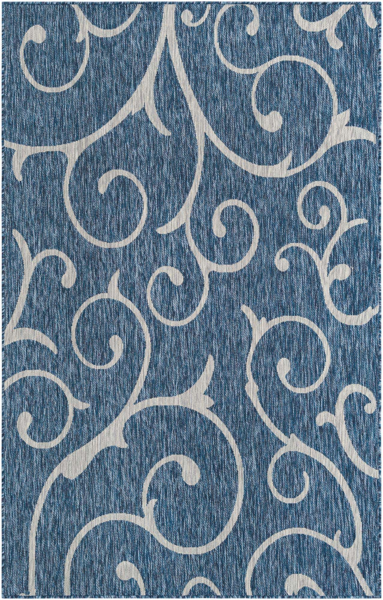 A 5x8 rectangular blue indoor/outdoor rug with an intricate white botanical scroll pattern, featuring a textured flatweave.