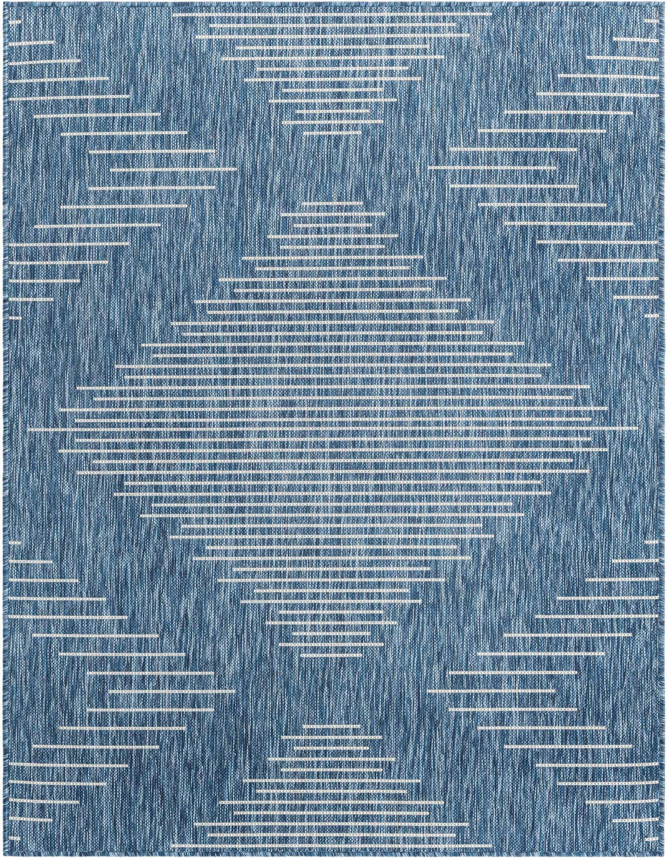 A 4x6 rectangular blue indoor/outdoor rug with a modern Southwestern geometric diamond pattern made of white horizontal stripes.