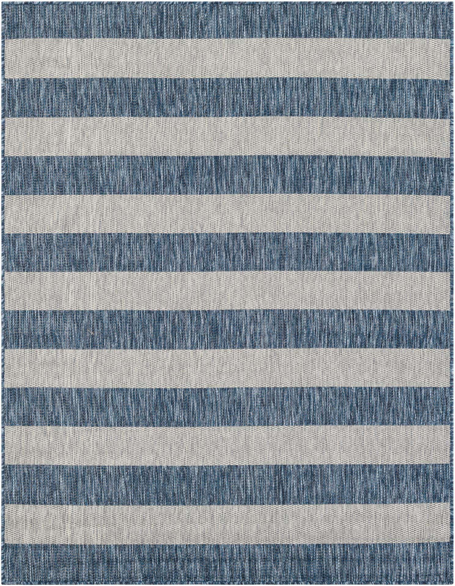 A 5x7 rectangular blue and white striped flatweave rug, ideal for indoor or outdoor spaces like a patio.