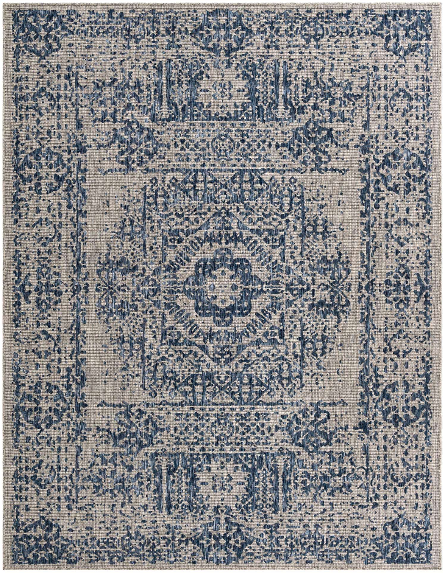 A 9x12 rectangular Southwestern rug in shades of blue and beige, featuring a distressed medallion pattern.
