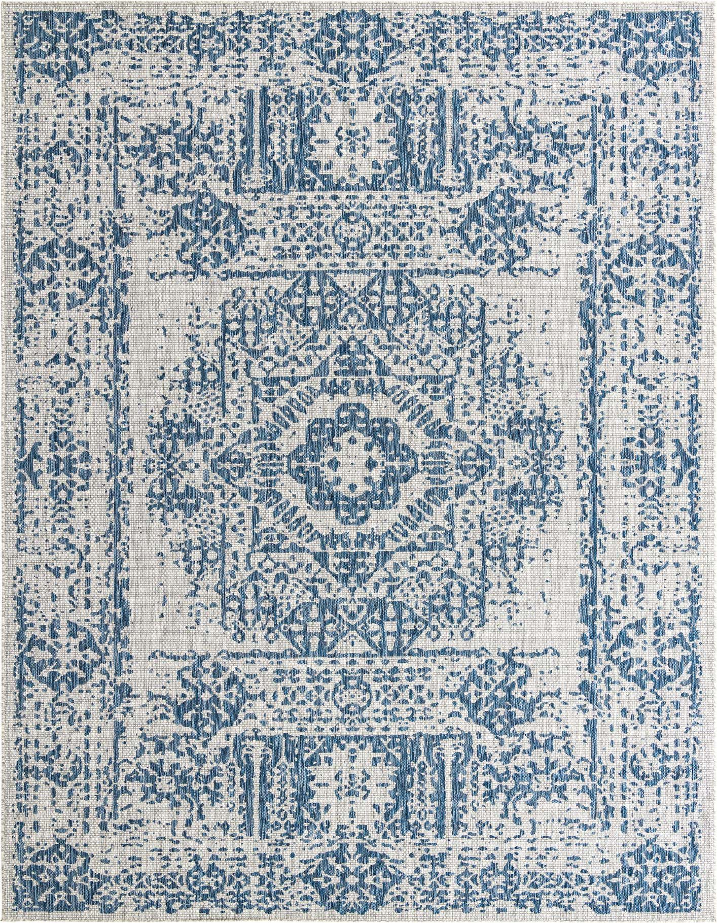 A 10x14 rectangular blue and white Southwestern-style outdoor rug with a central medallion pattern and textured flatweave.