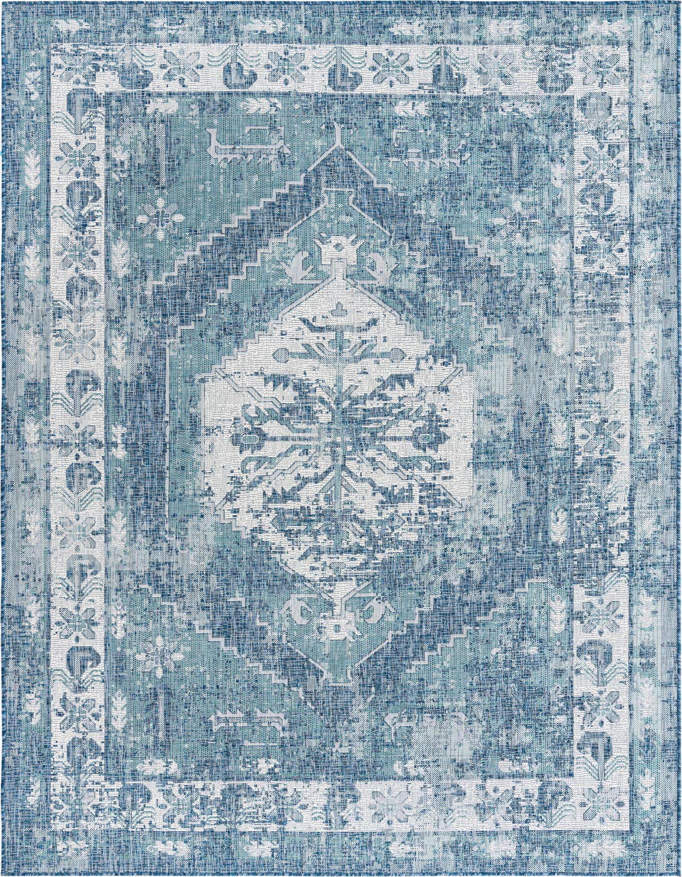 A 7x10 rectangular blue and white Southwestern-style indoor/outdoor rug with a distressed traditional pattern.