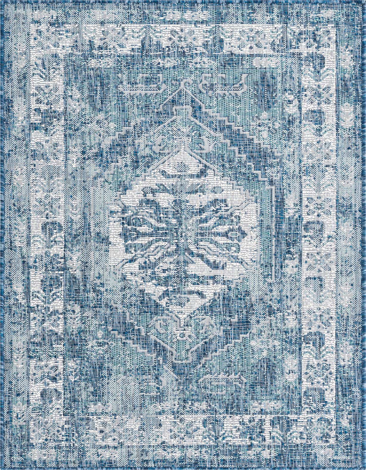 A 3x5 rectangular indoor/outdoor rug featuring a distressed Southwestern medallion pattern in varying shades of blue and white.
