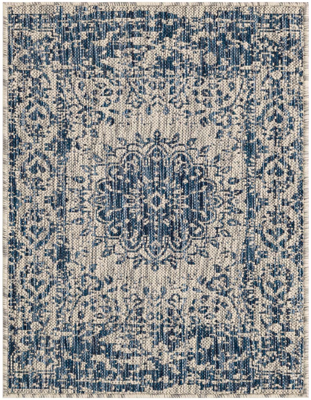 A 2x3 rectangular blue and off-white indoor/outdoor rug with a distressed traditional medallion pattern and flatweave texture.