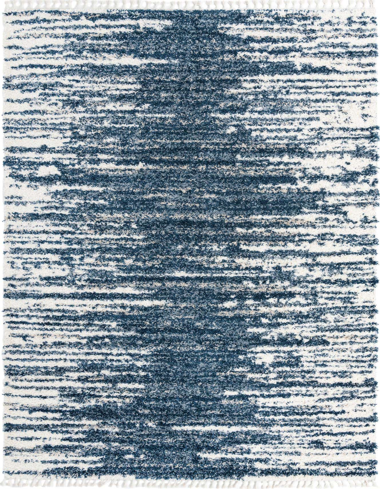 A 10x14 rectangular Serenity Shag rug featuring a textured abstract pattern in various shades of blue and white.