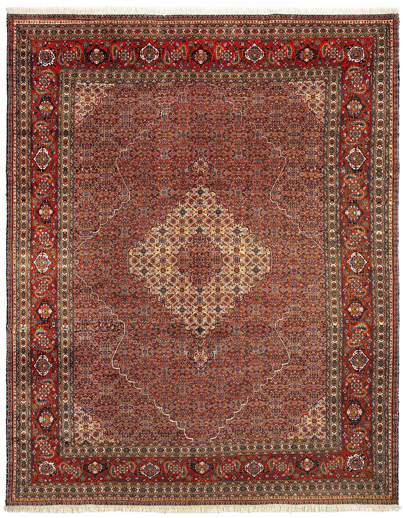 A 9x12 rectangular Persian Tabriz rug in rich blues with intricate traditional patterns and a central medallion.