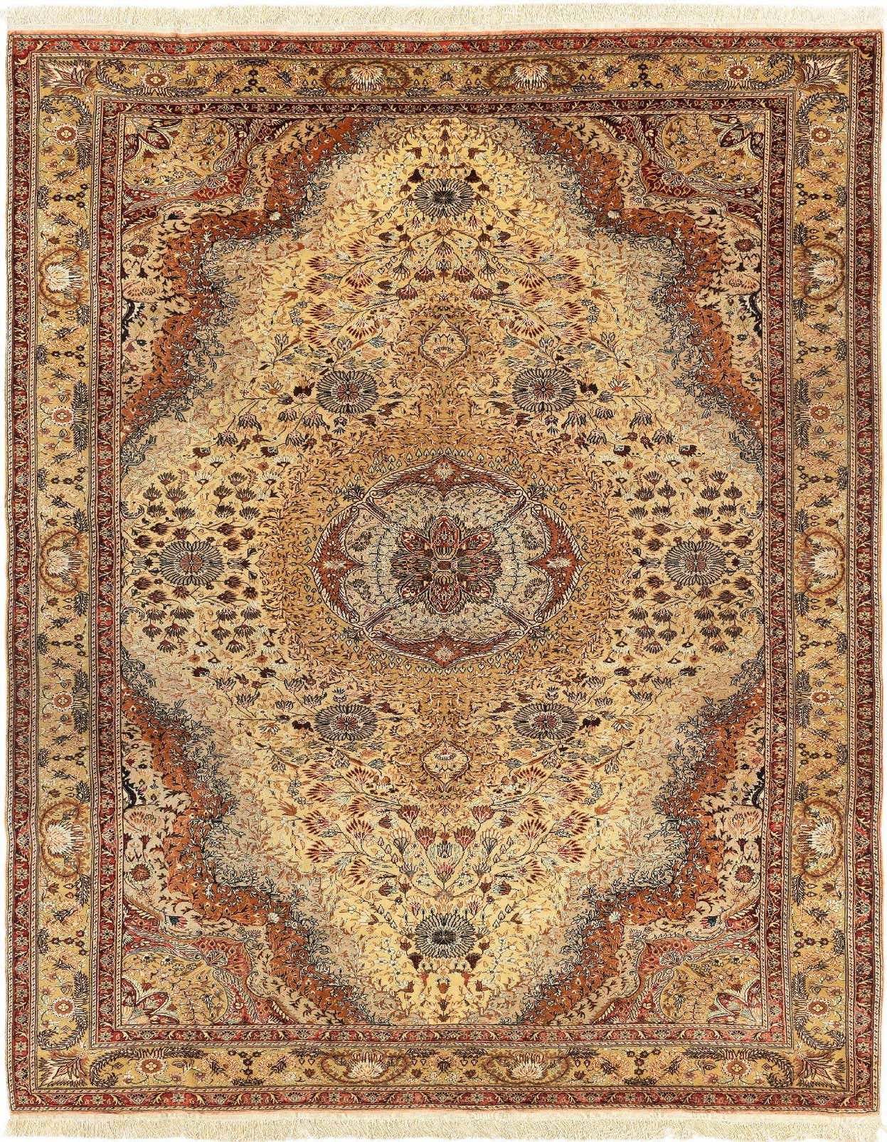 A luxurious 6x9 rectangular Tabriz rug in blues, featuring intricate floral patterns and a central medallion, perfect for a living room.