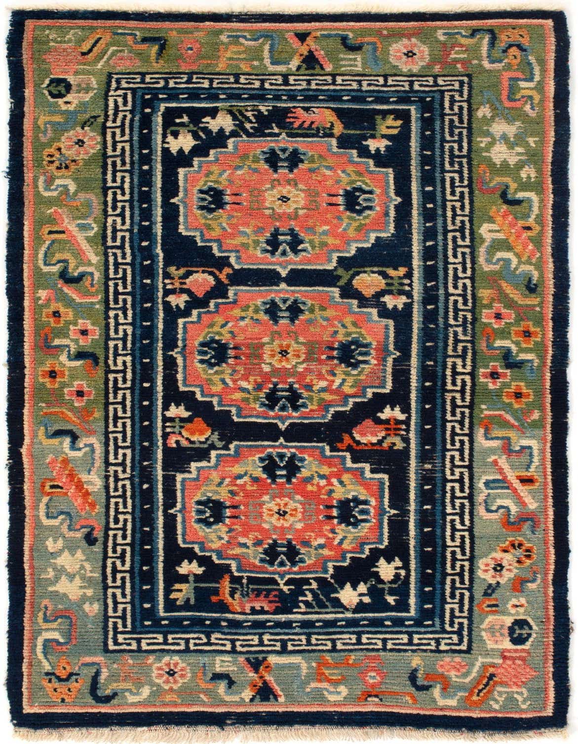 A 3x4 rectangular Tibet collection rug featuring a rich blue field with coral and green oriental patterns, framed by a green border.