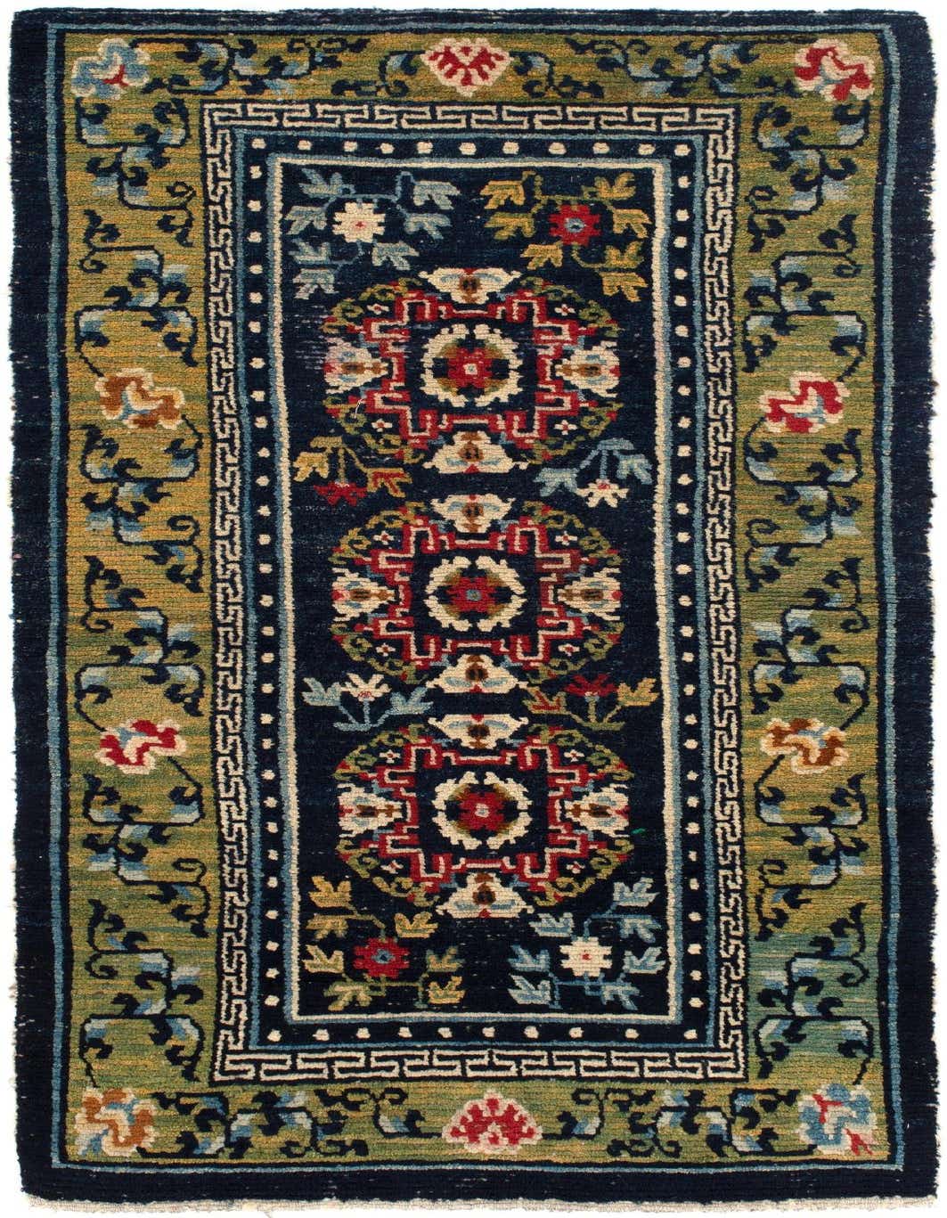 A 3x4 rectangular wool rug with a dark blue field featuring three ornate medallion patterns in red, cream, and light blue, surrounded by a green border with floral motifs and a geometric inner border.