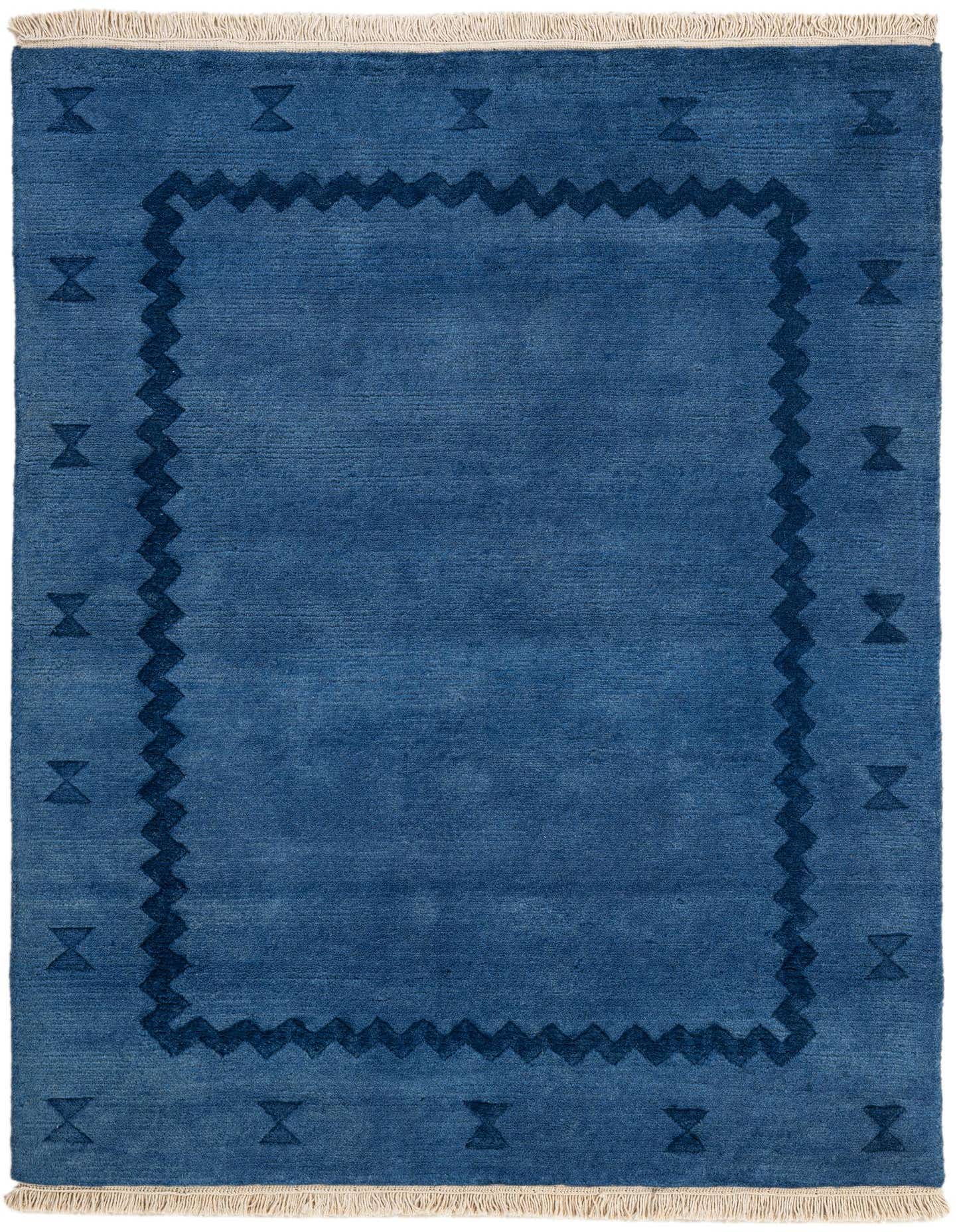 A 4x6 rectangular blue wool rug with a darker blue zigzag border and small abstract shapes, perfect for a living room.