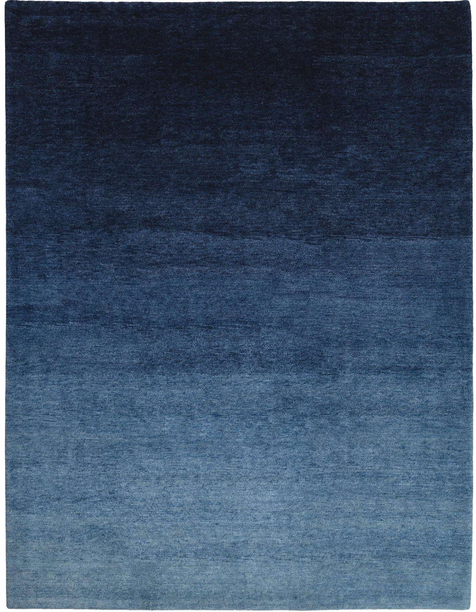A 6x9 rectangular blue oriental rug with a dark navy to light blue ombre gradient, suitable for a living room.