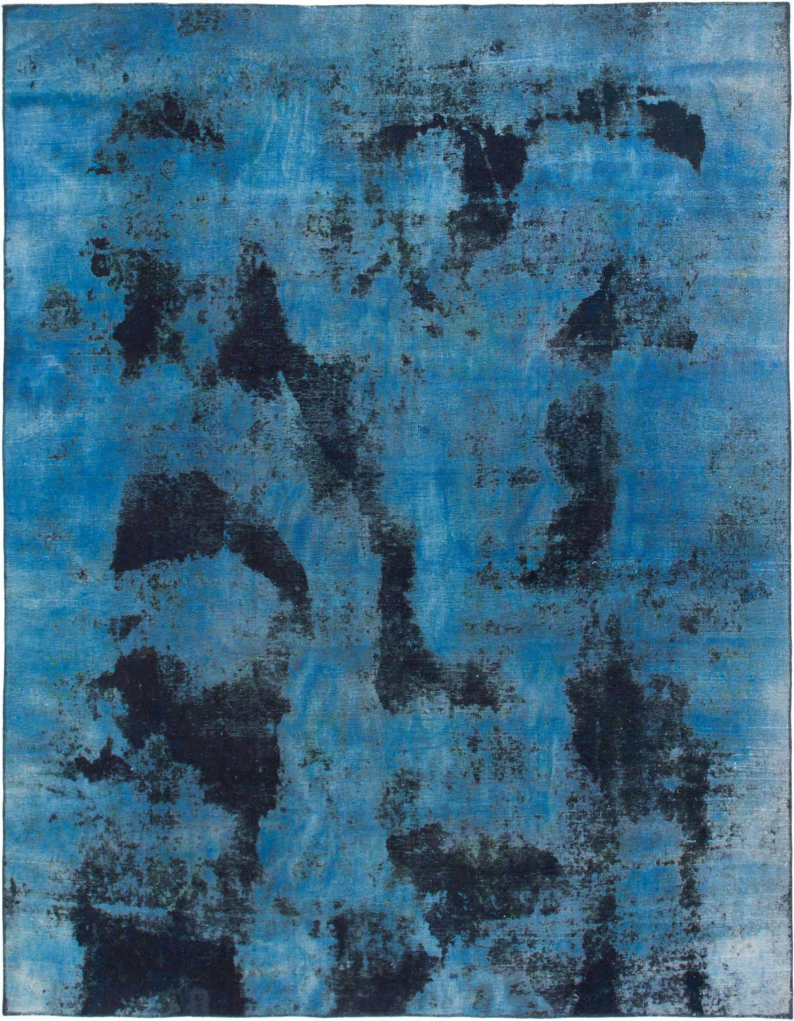 A large 9x12 rectangular Ultra Vintage rug in varying shades of blue with abstract black distressed patterns, suitable for a living room.