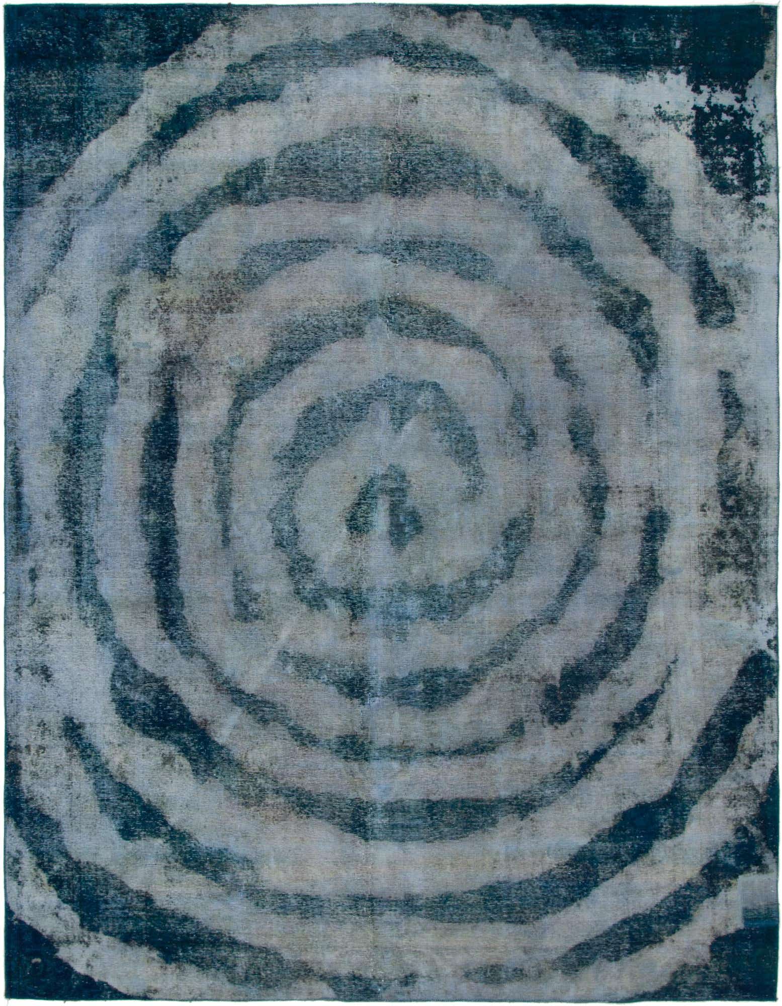 A 9x12 rectangular Ultra Vintage wool rug featuring an abstract, faded concentric circle pattern in varying shades of blue.