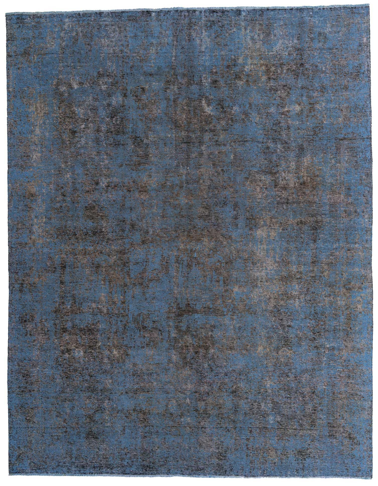 A large 9x12 rectangular Ultra Vintage rug in varying shades of blue and gray with an abstract, distressed Persian pattern, suitable for a living room.