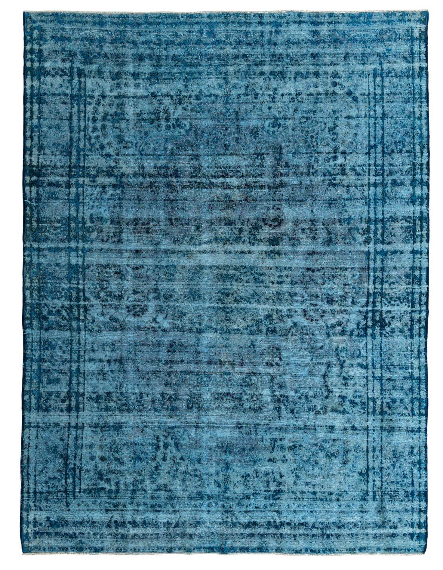 A 10x13 rectangular blue Persian-style rug with a distressed vintage medallion pattern, suitable for a living room.