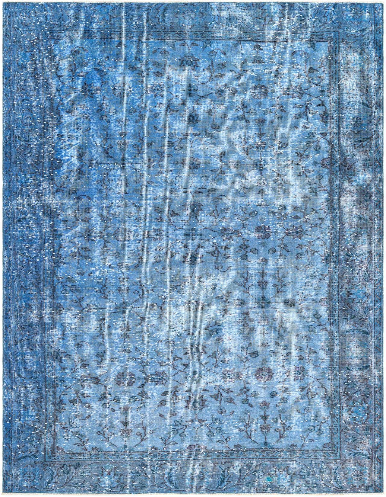 A 5x8 rectangular Ultra Vintage rug in varying shades of blue, featuring a faded Persian-inspired pattern and a flat pile, suitable for a living room.