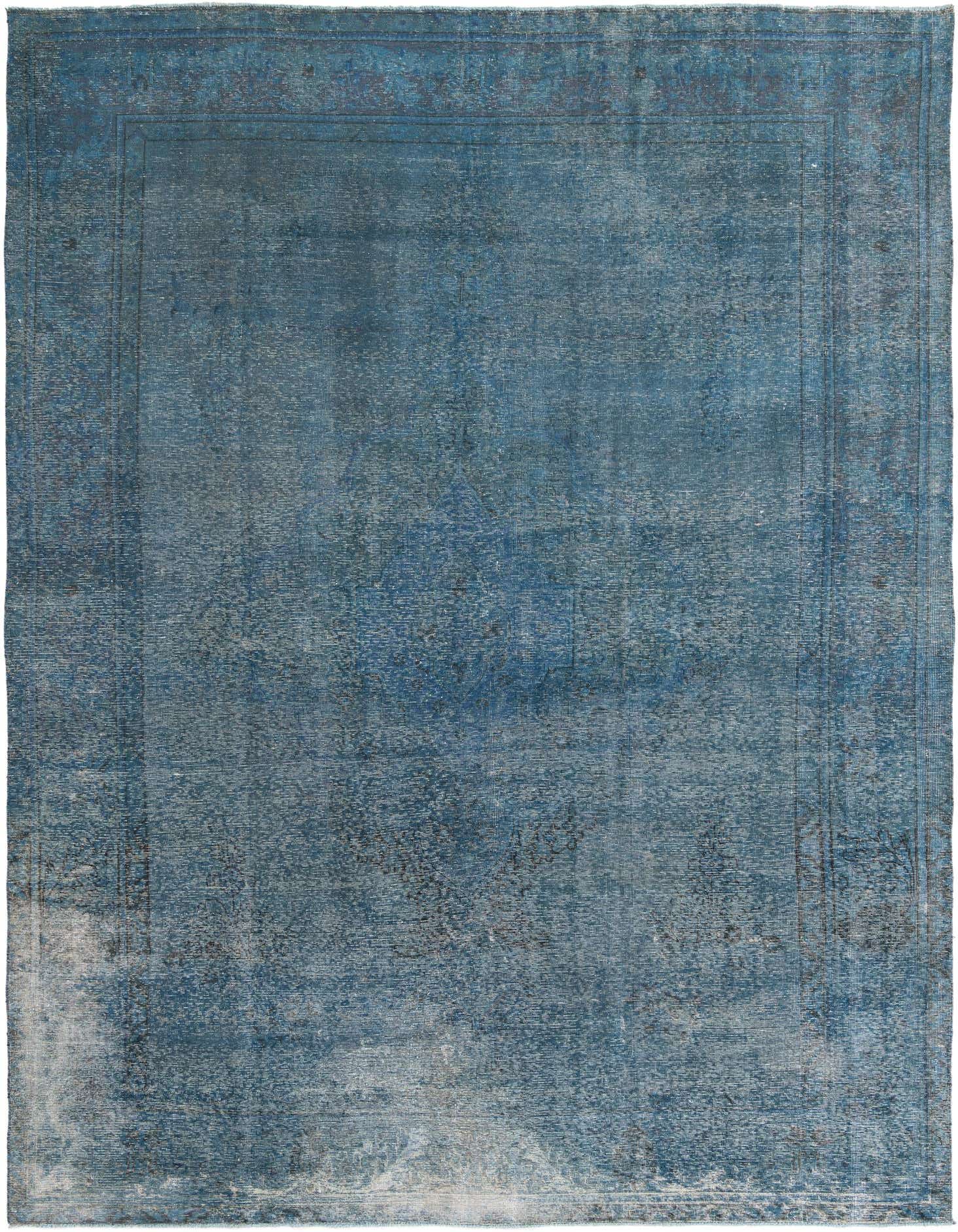 A large 10x13 rectangular blue wool rug with a faded vintage Persian medallion pattern and subtle border.