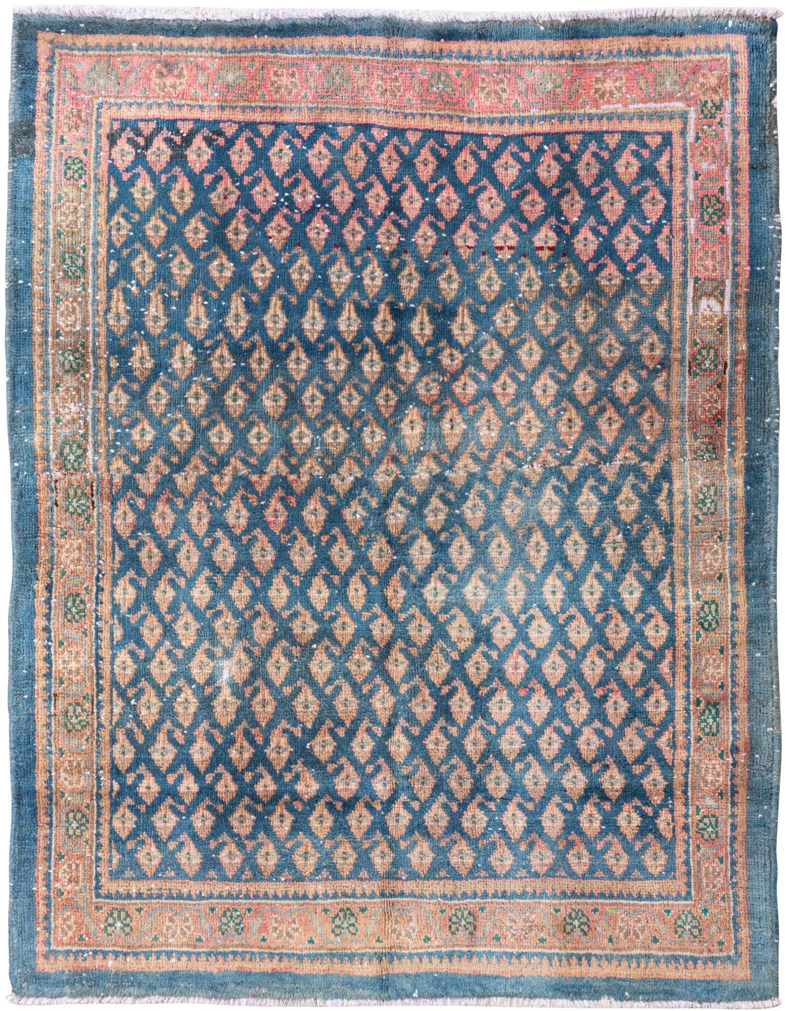 A 3x5 rectangular blue Persian rug with an all-over diamond pattern in faded peach and a floral border.