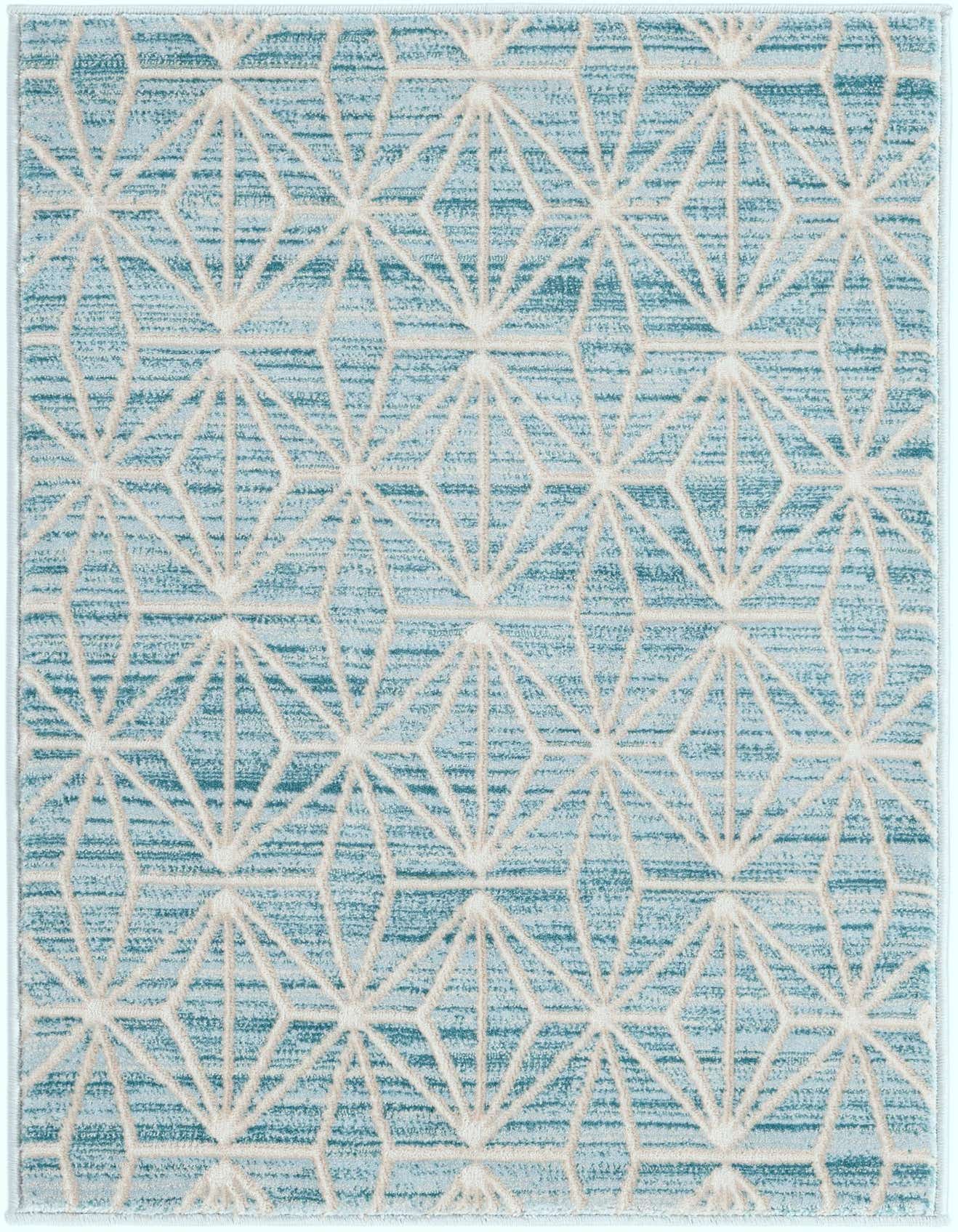 A 2x3 rectangular Uptown rug featuring a modern abstract geometric pattern in varying shades of blue and cream.