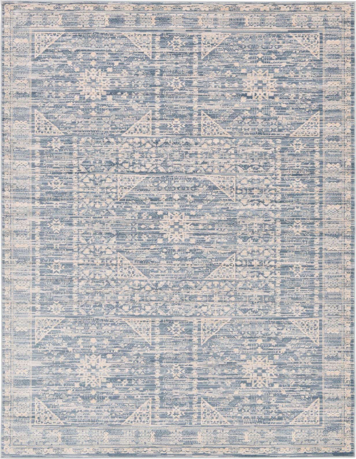 A 5x8 rectangular indoor rug featuring a distressed bohemian medallion pattern in varying shades of blue and cream.