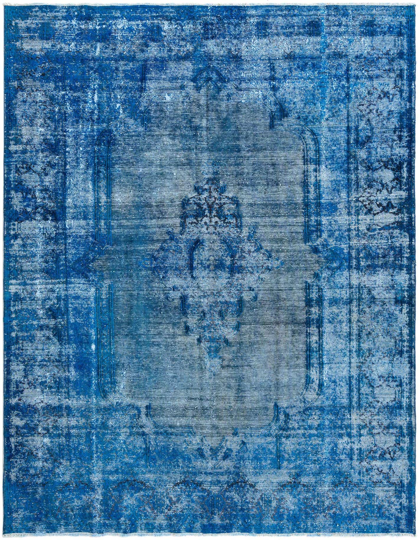 A 6x9 rectangular Rugs.com Vintage Royal Persian rug in varying shades of blue with a distressed, faded pattern.