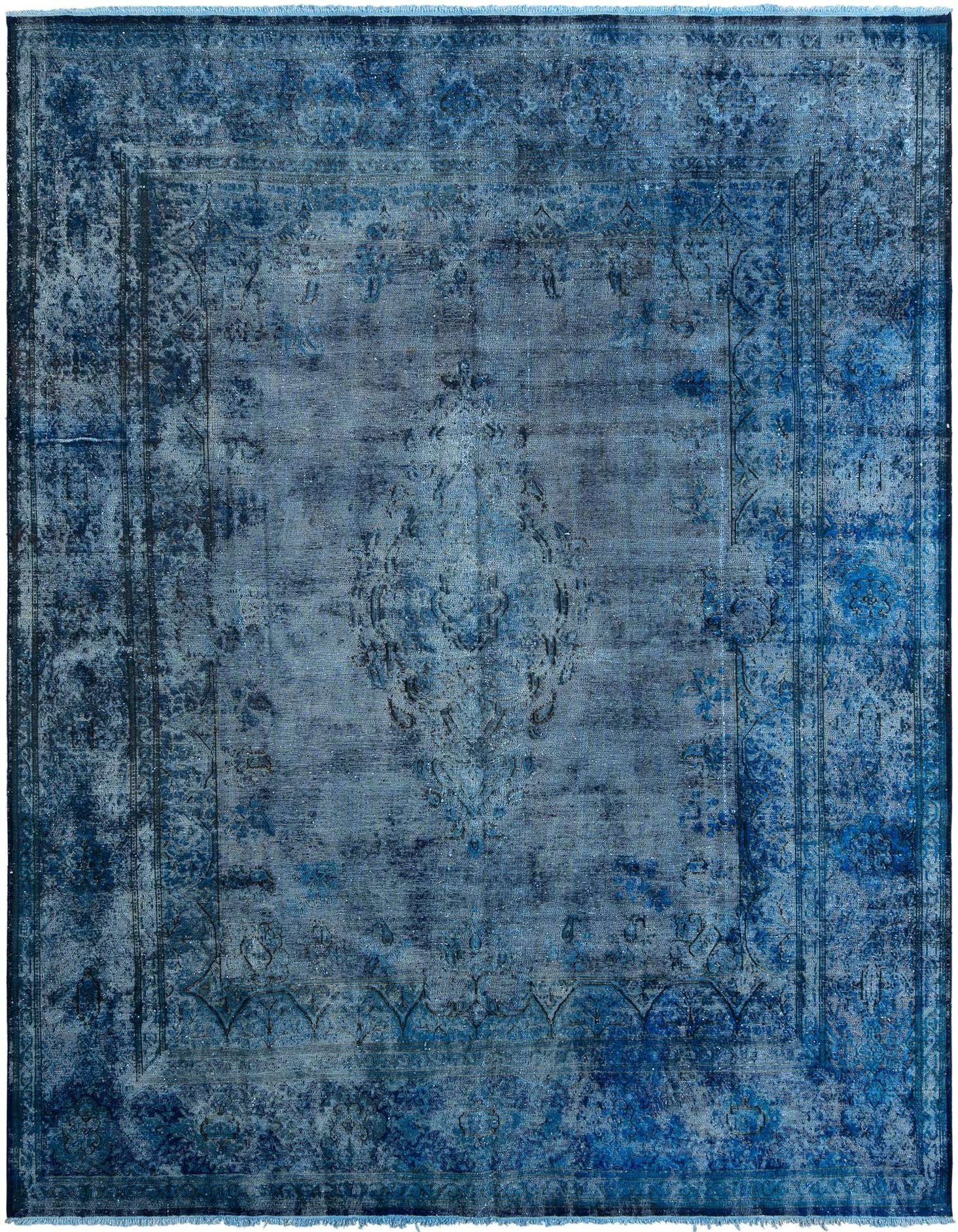 A 10x13 rectangular blue Persian wool rug with a distressed vintage pattern, ideal for a living room.