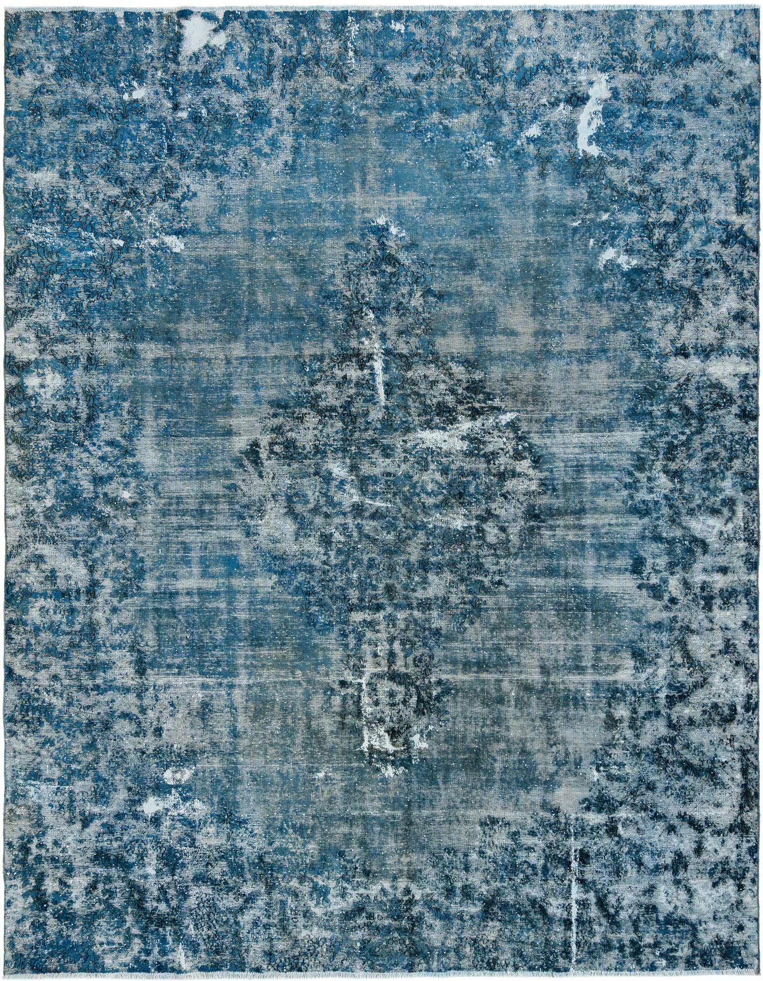 A 9x12 rectangular Vintage Royal Persian rug in varying shades of blue, featuring a distressed, faded pattern.