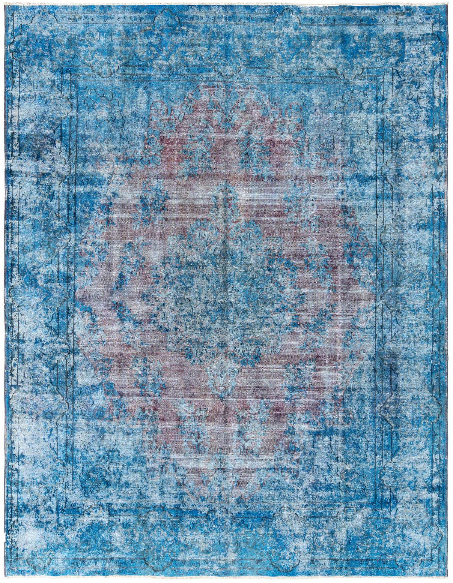 A large 10x13 rectangular blue Persian rug with a faded traditional pattern and a central medallion.