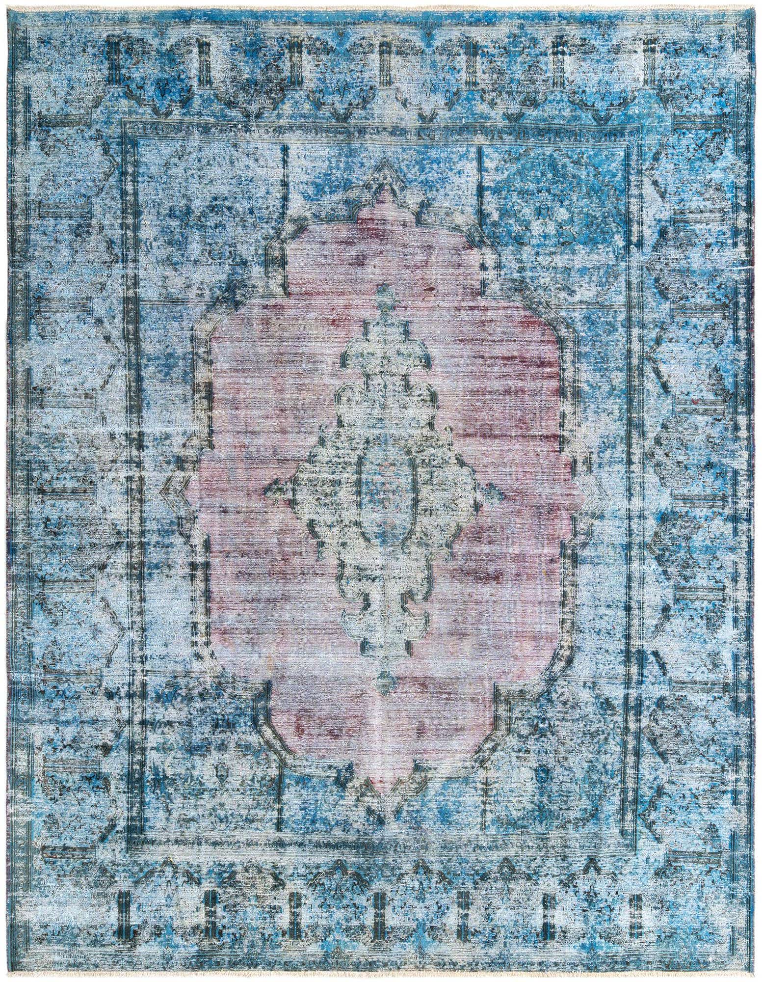 A 10x13 rectangular blue Persian rug with a distressed look and a faded pink central medallion.