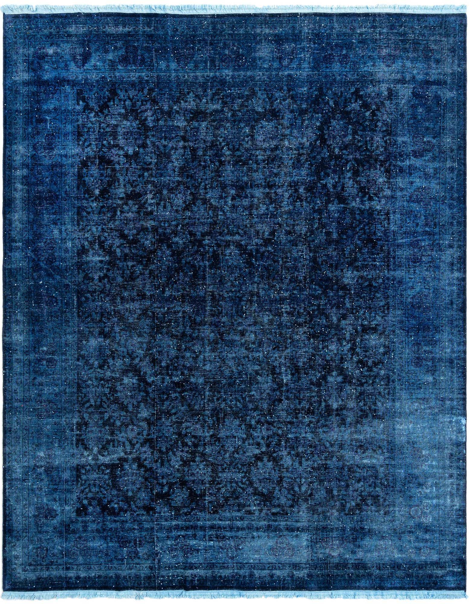 An 8x10 rectangular blue Persian wool rug with a distressed, traditional floral pattern and light fringe.