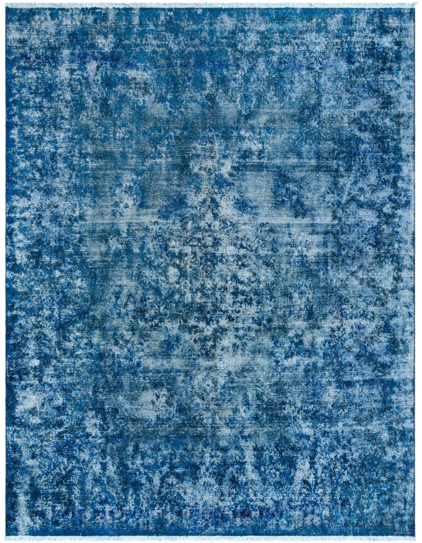 A 10x13 rectangular blue Persian rug with a distressed, vintage-inspired pattern, ideal for a living room.