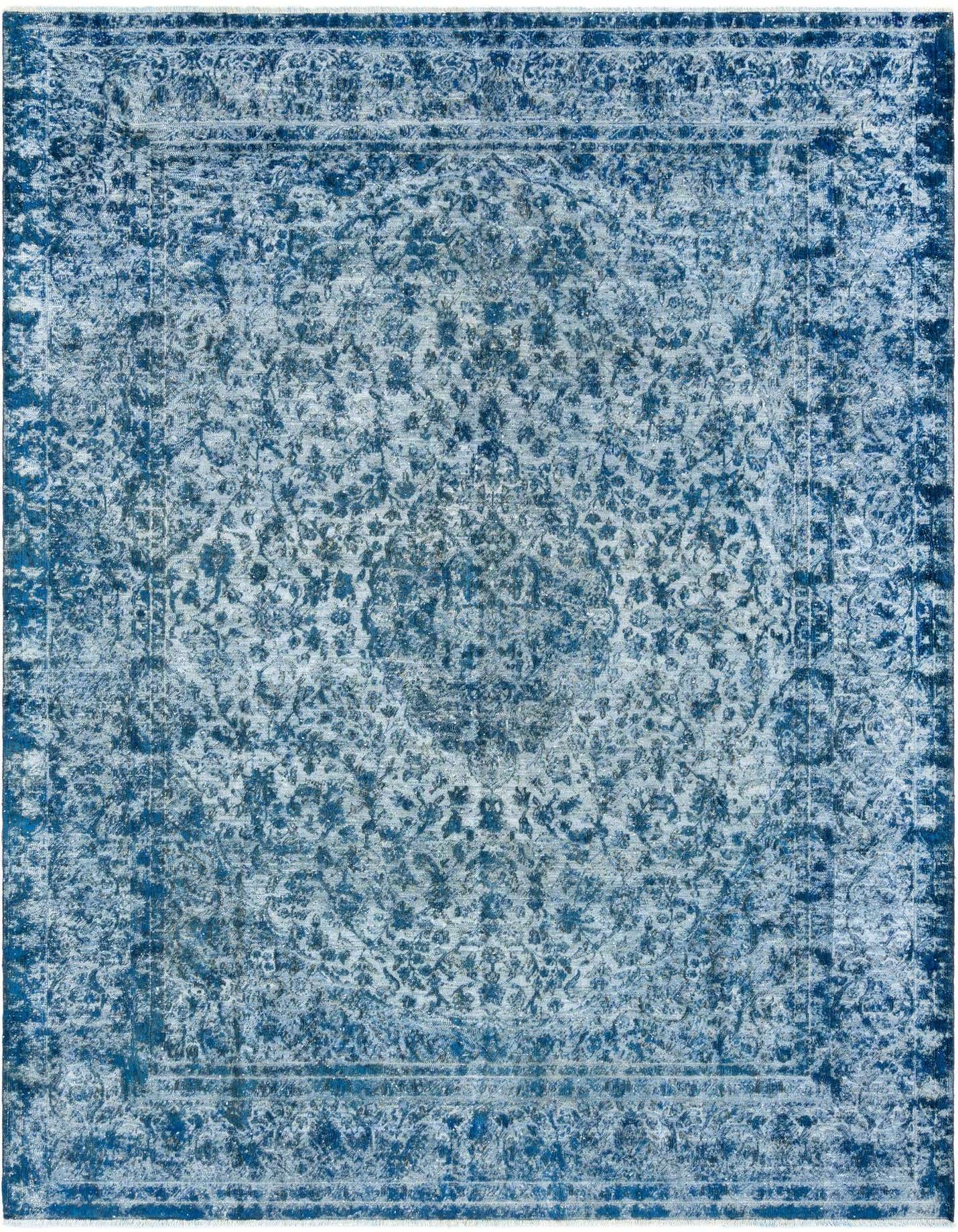 A 9x12 rectangular blue Persian wool rug with a distressed floral pattern and border, suitable for a living room.