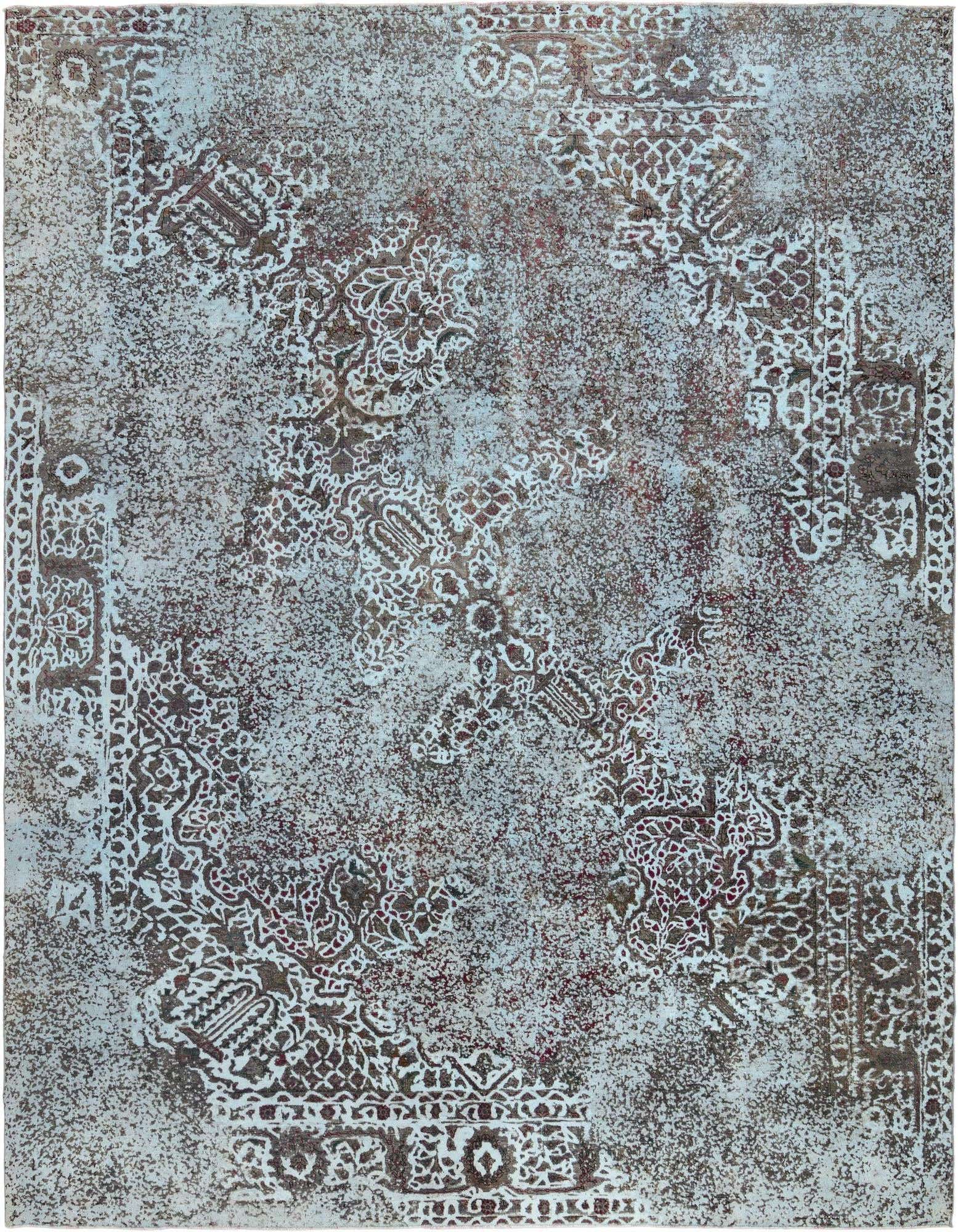 A 9x12 rectangular blue Persian rug with an intentionally distressed, vintage-style pattern in a living room setting.
