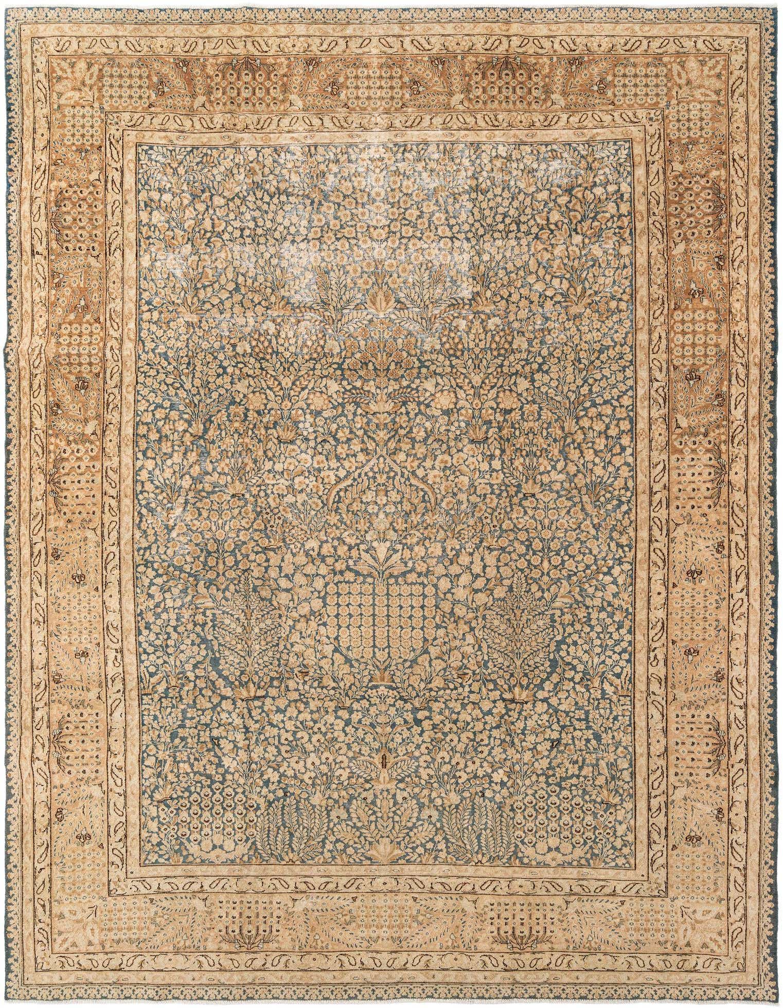 An 8x11 rectangular Vintage Royal wool rug featuring a dense floral pattern in blues and beige, with a multi-layered border.