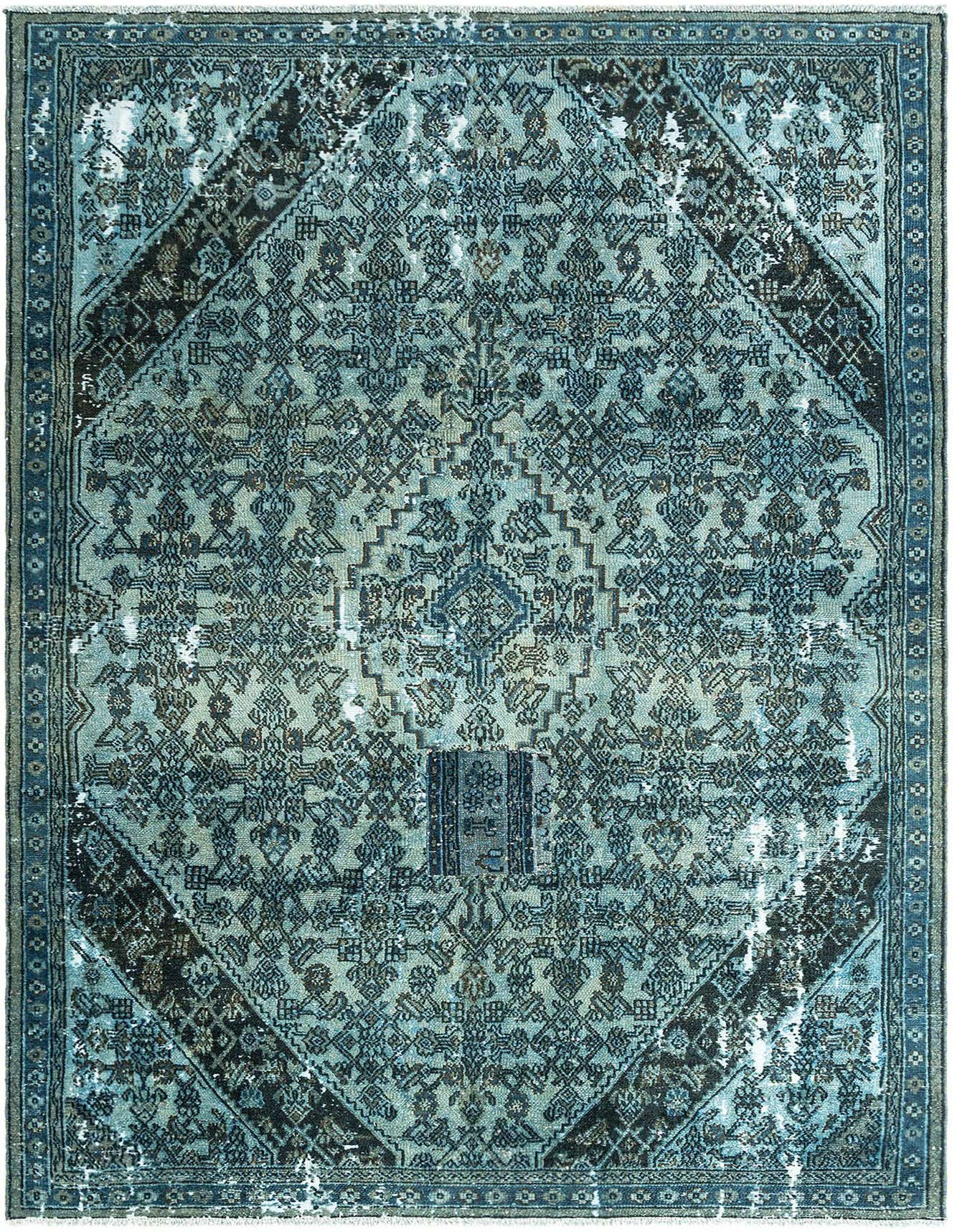 A 7x10 rectangular blue vintage wool rug with a distressed traditional pattern and dark diamond accents.
