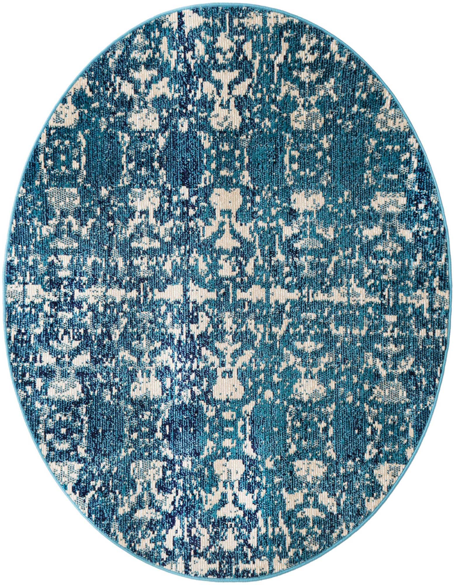 A 4' round blue and cream polypropylene rug with an abstract, distressed pattern and textured pile.