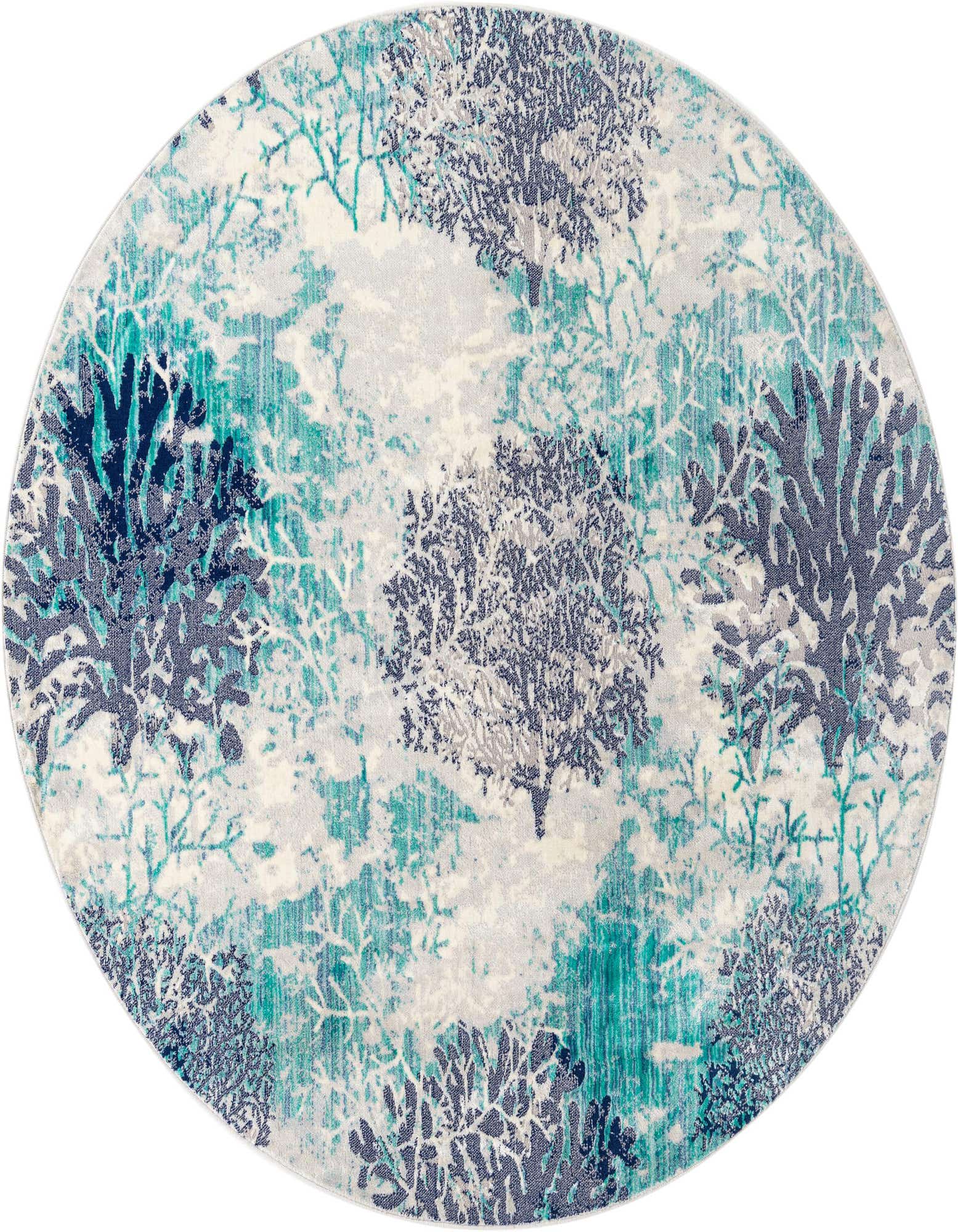 A 7' round blue botanical rug featuring an abstract pattern of teal, navy, and grey coral-like branches on a light background.