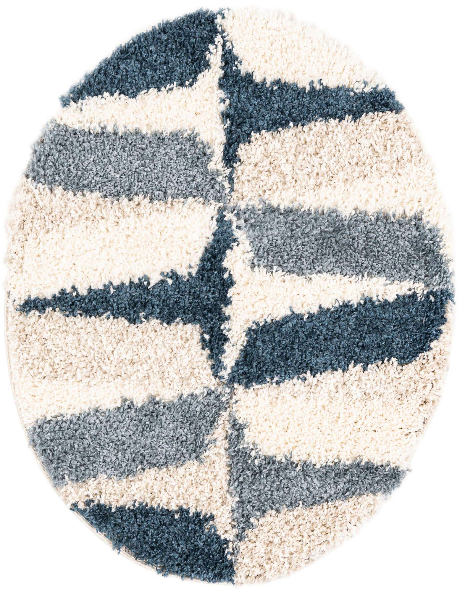 A round 3' 3 x 3' 3 blue and cream shag rug with a modern abstract pattern, perfect for adding comfort to an indoor space.