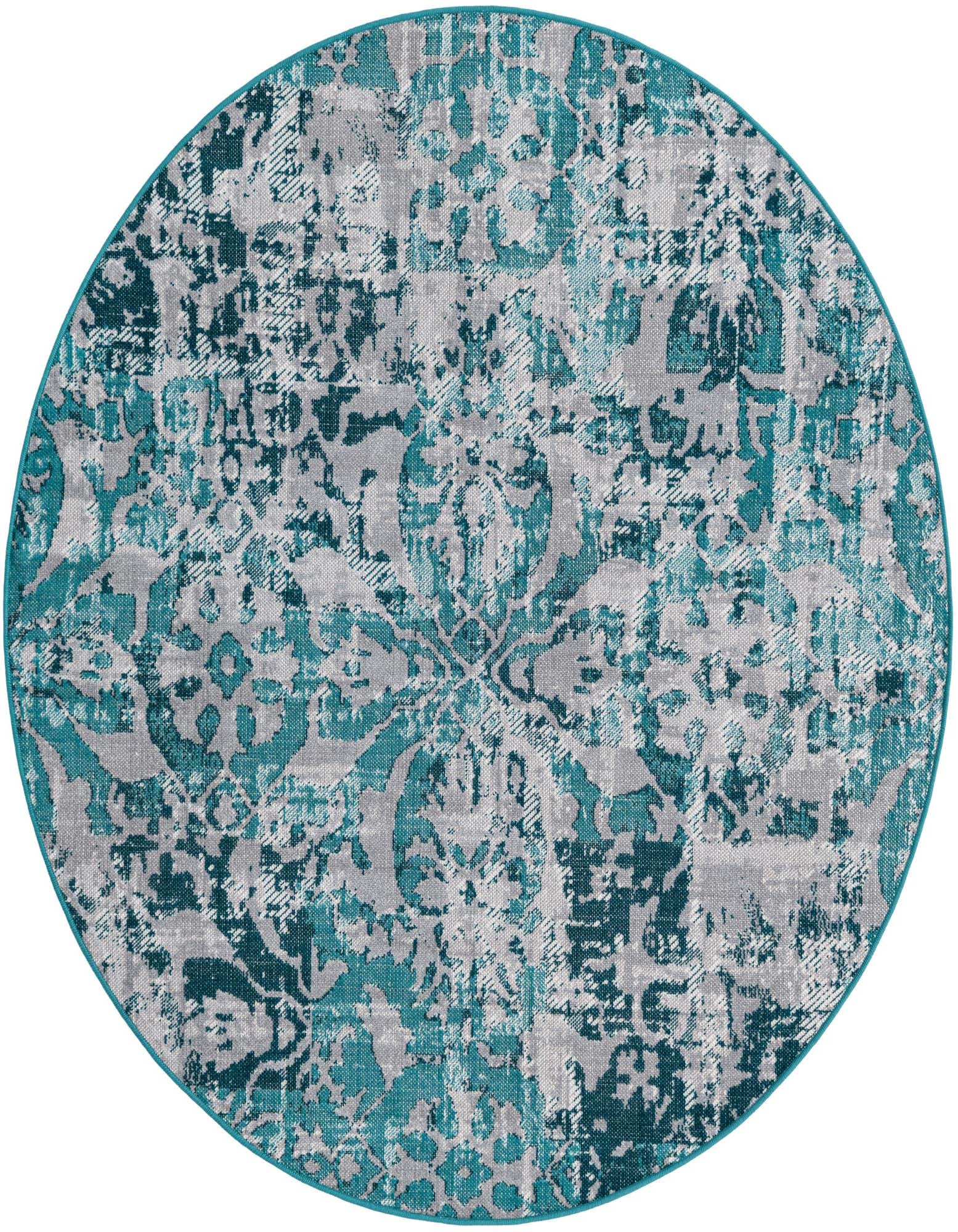 A 5' 3 round blue and gray bohemian rug with a distressed floral and medallion pattern.