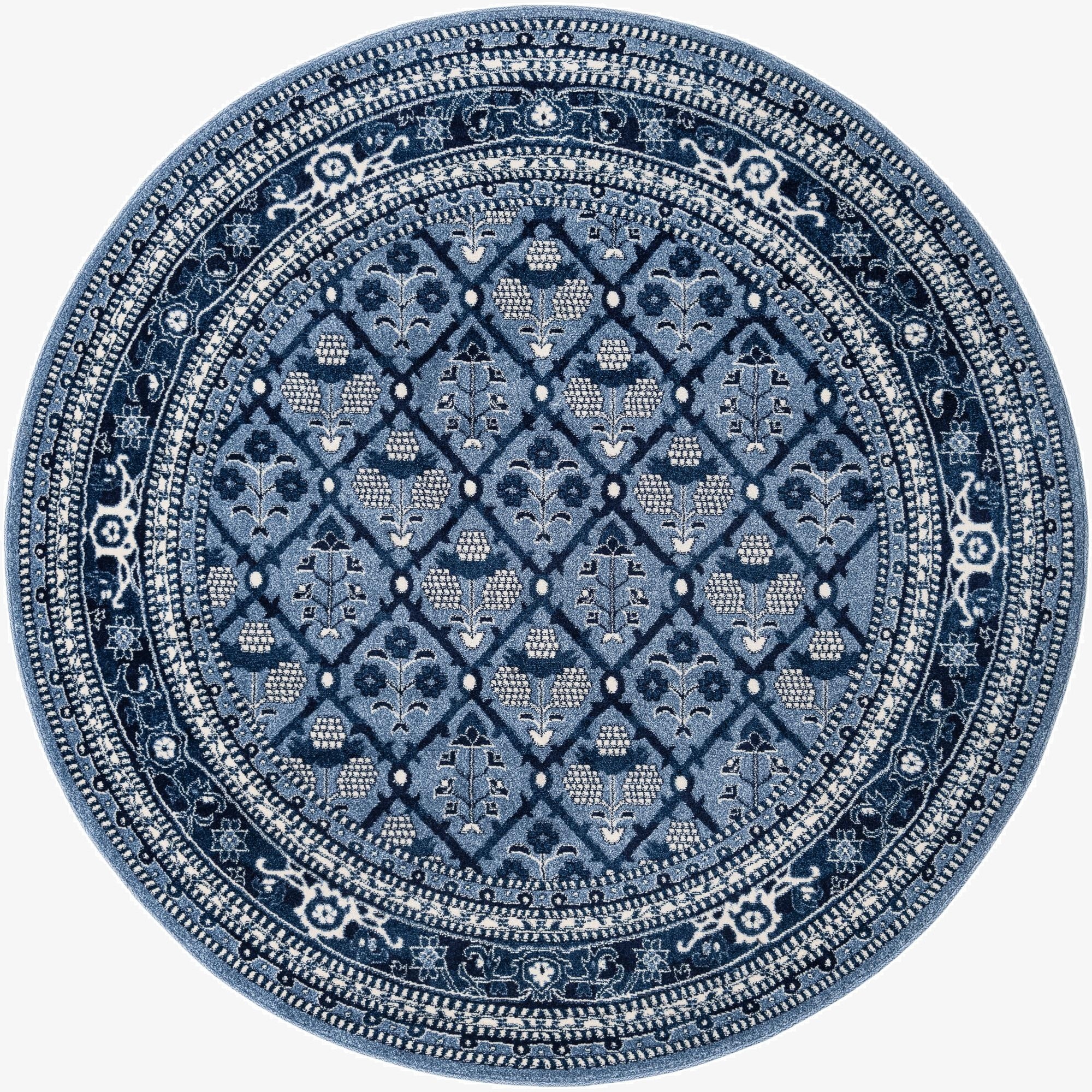 A round blue rug with a detailed traditional botanical pattern and a wide decorative border, suitable for various indoor spaces.