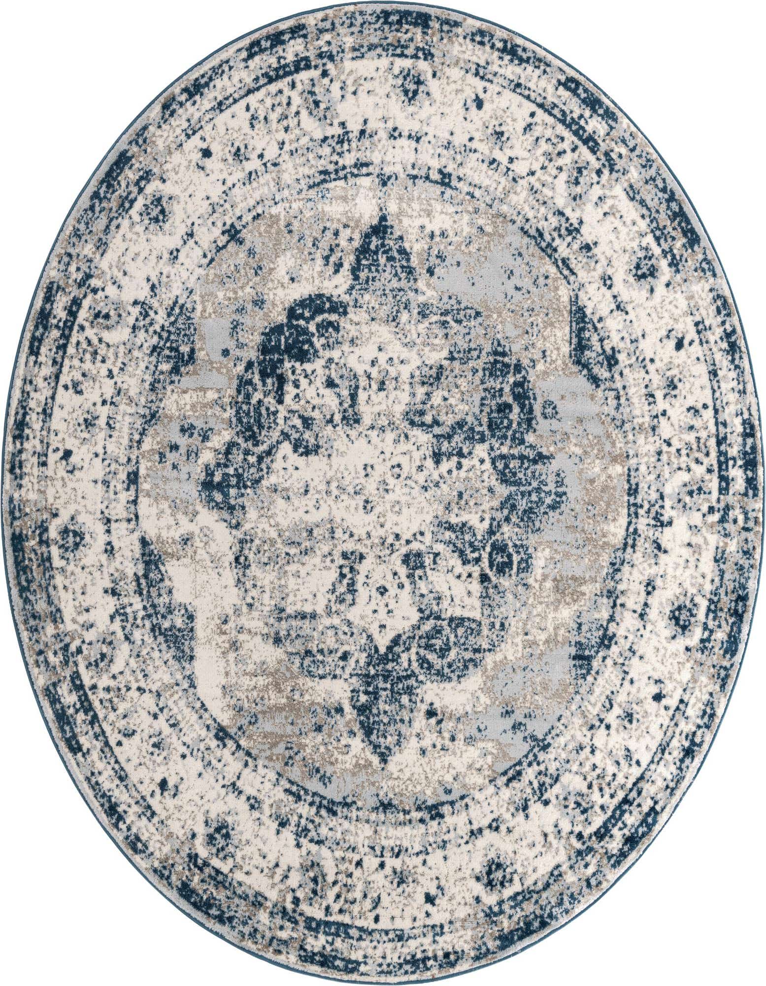 A 7' round blue and cream medallion rug with a distressed bohemian and traditional pattern.
