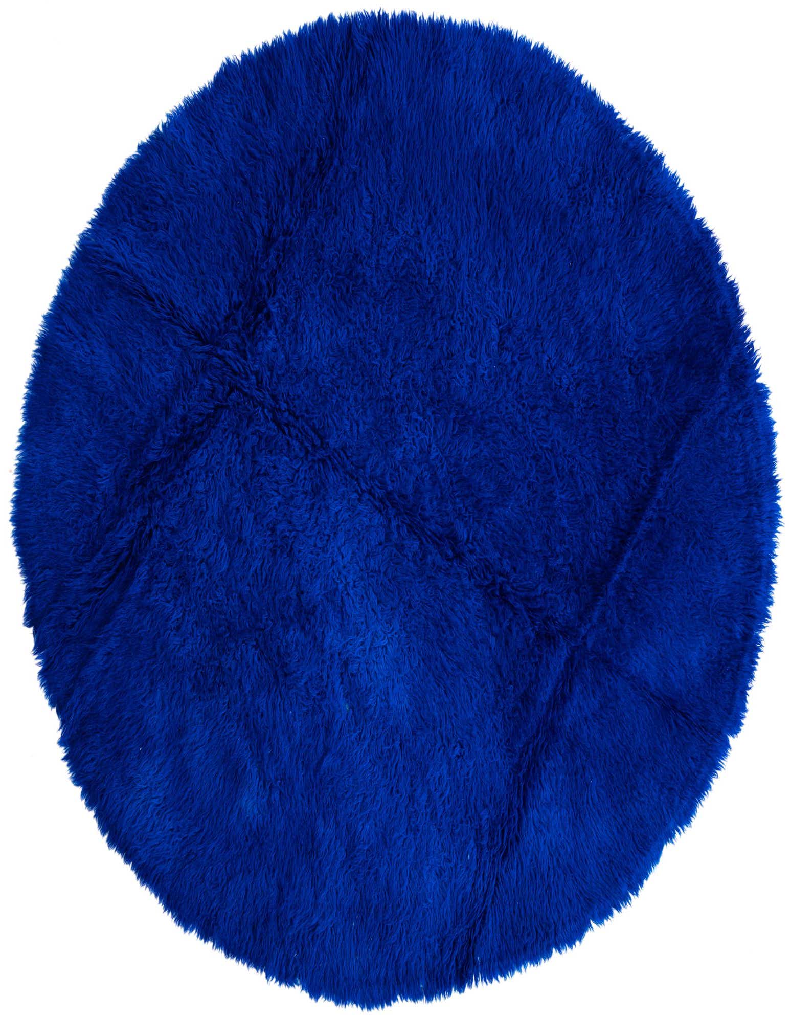 A vibrant blue round shag rug, 6' 5 x 6' 5, made of wool, showcasing its plush texture.