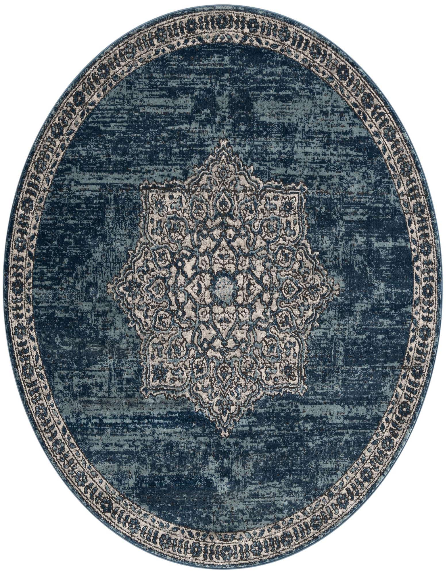 A round, distressed blue rug with a light blue and cream medallion pattern in the center and a matching border.