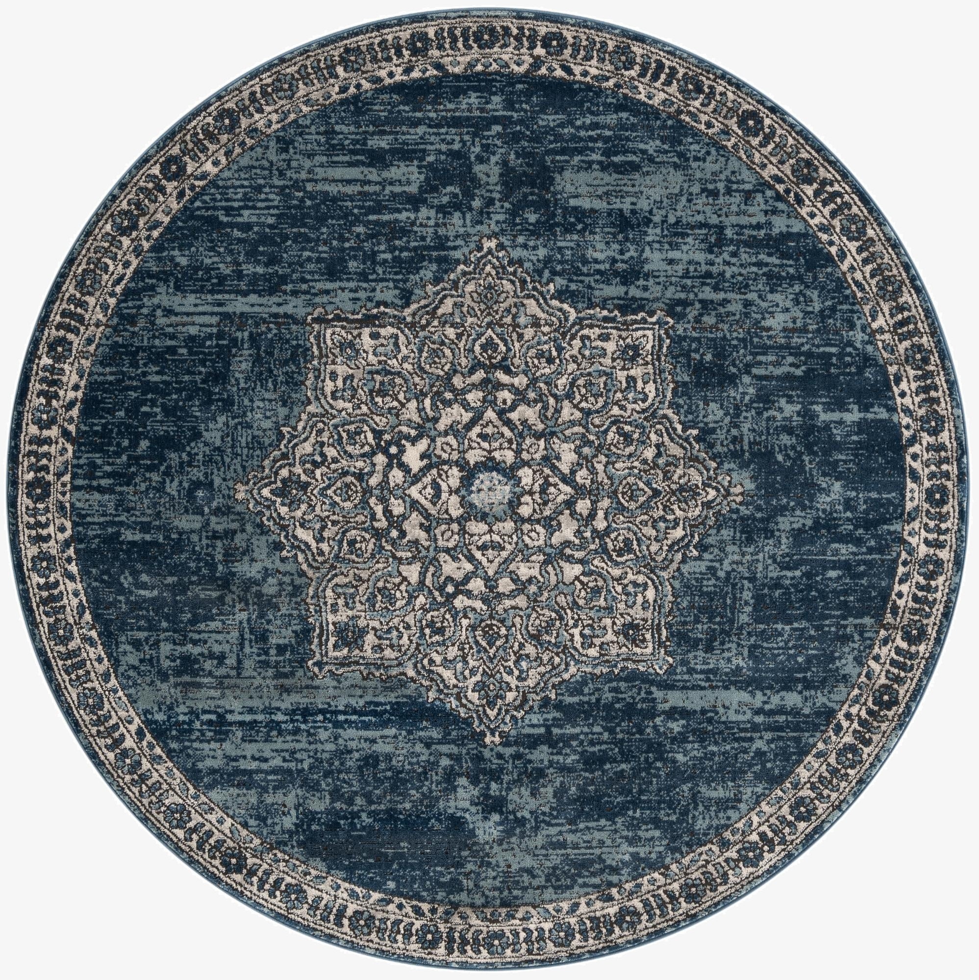 A round, distressed blue rug with a light blue and cream medallion pattern in the center and a matching border.
