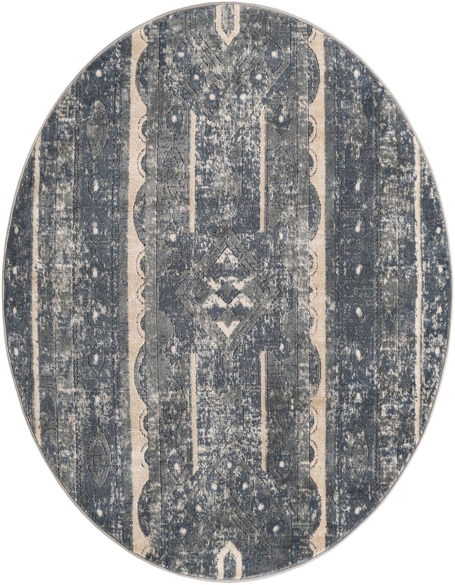 A 5' 3 round blue bohemian rug with a distressed tribal stripe pattern in shades of blue and beige.