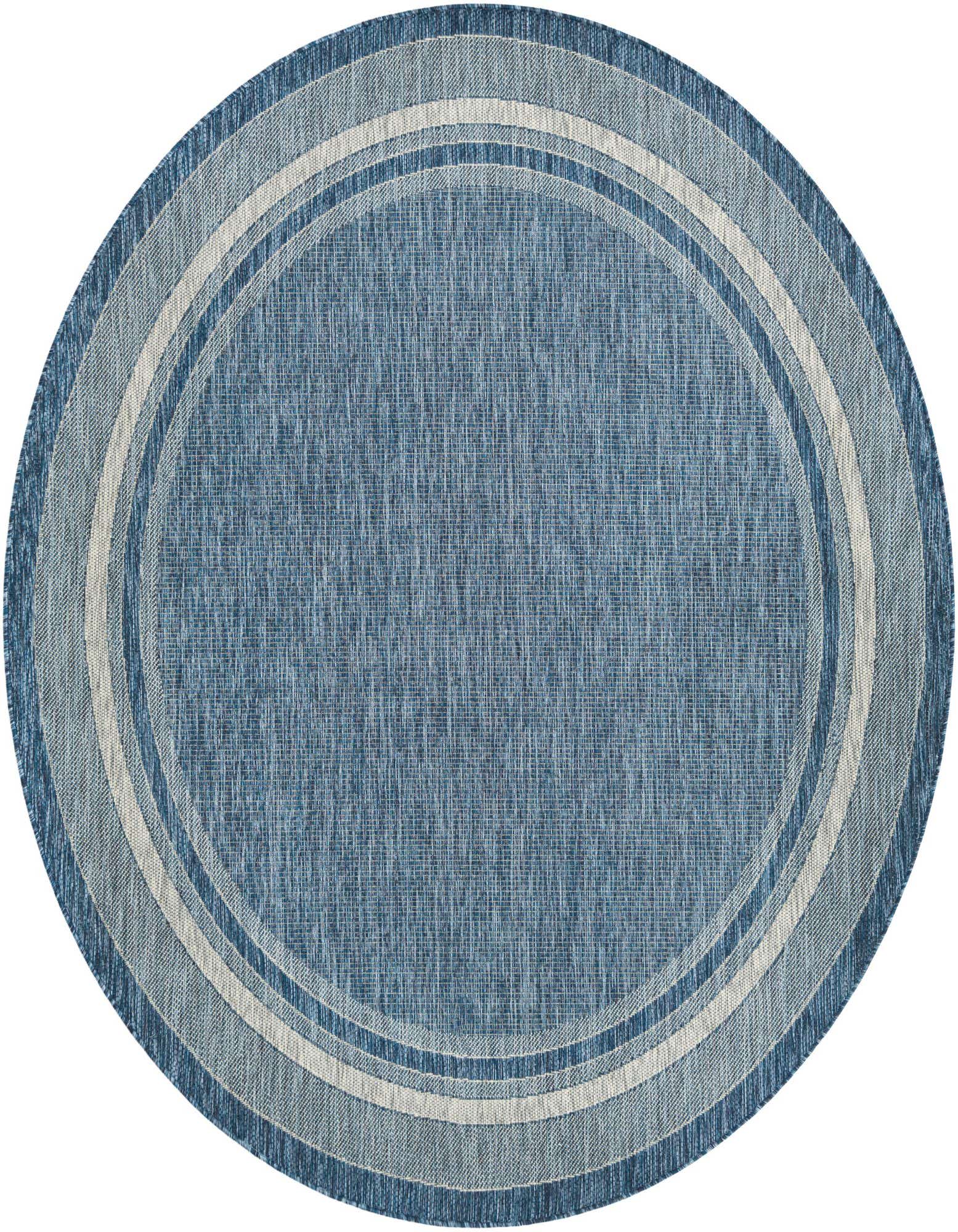 A round blue indoor/outdoor rug with concentric light blue and off-white border stripes, perfect for a patio.