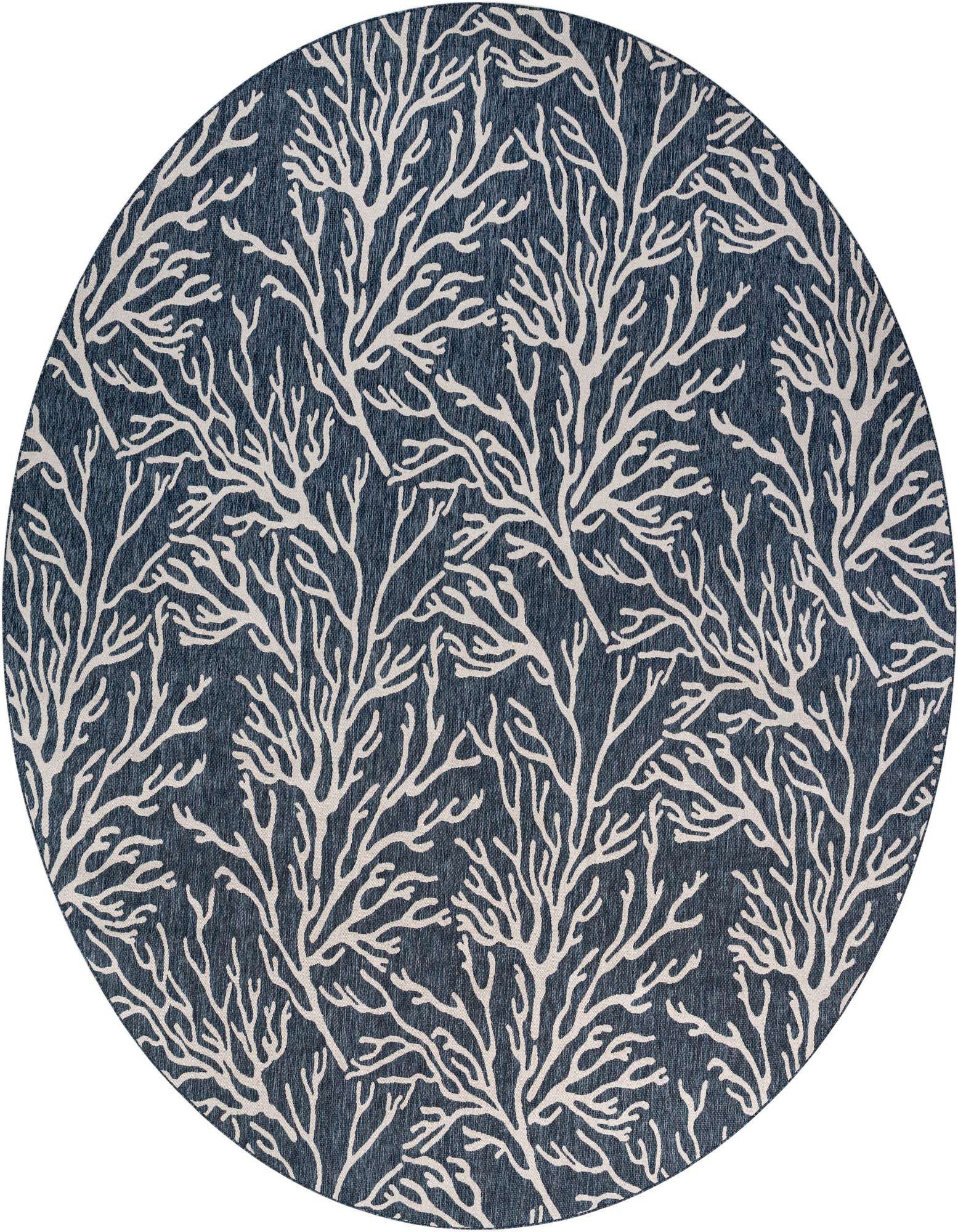 A round blue indoor/outdoor rug with a white coral branch pattern, suitable for a patio or coastal living space.