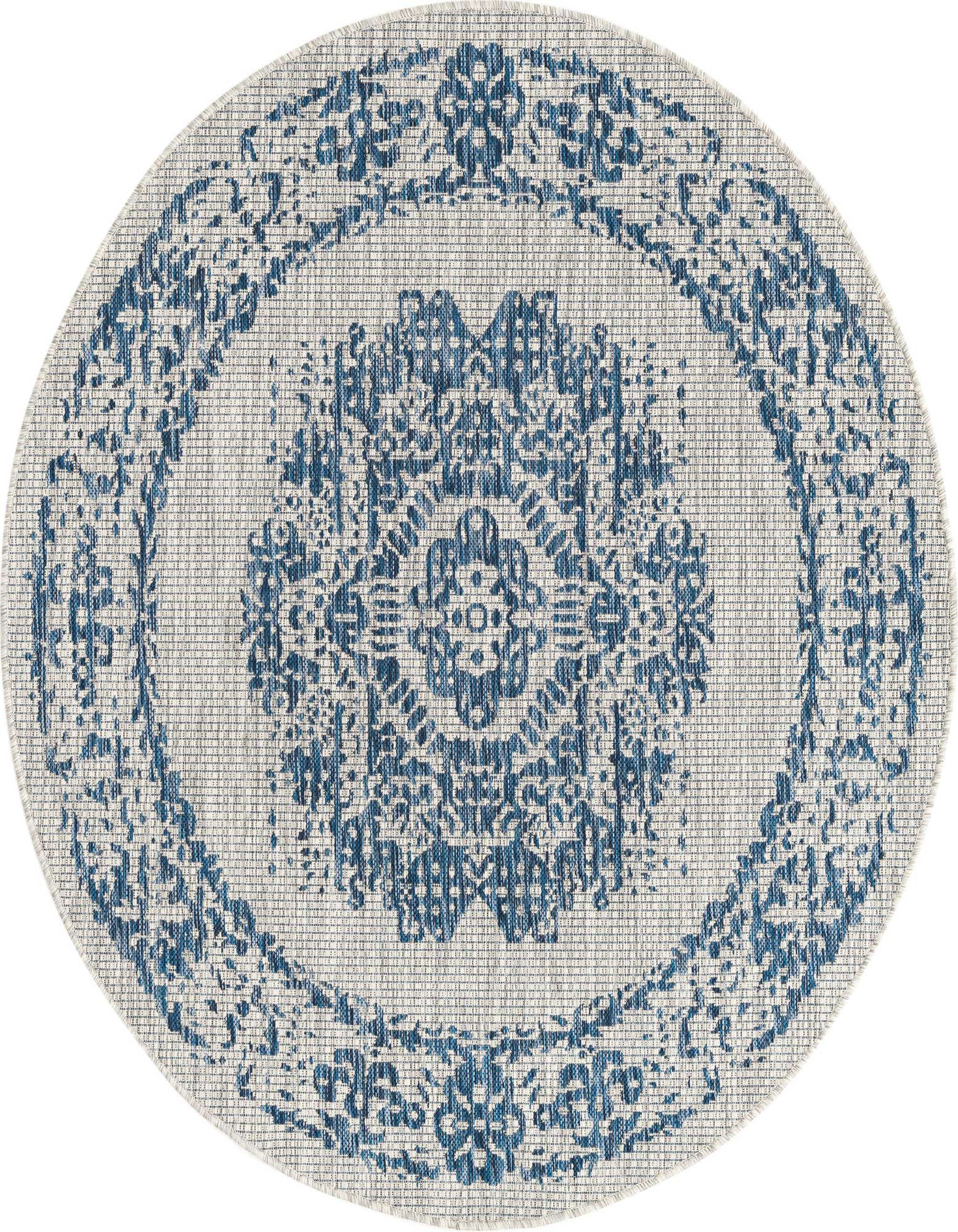 A 5' 3 round blue and white Southwestern medallion rug with a flatweave texture, suitable for indoor or outdoor use.