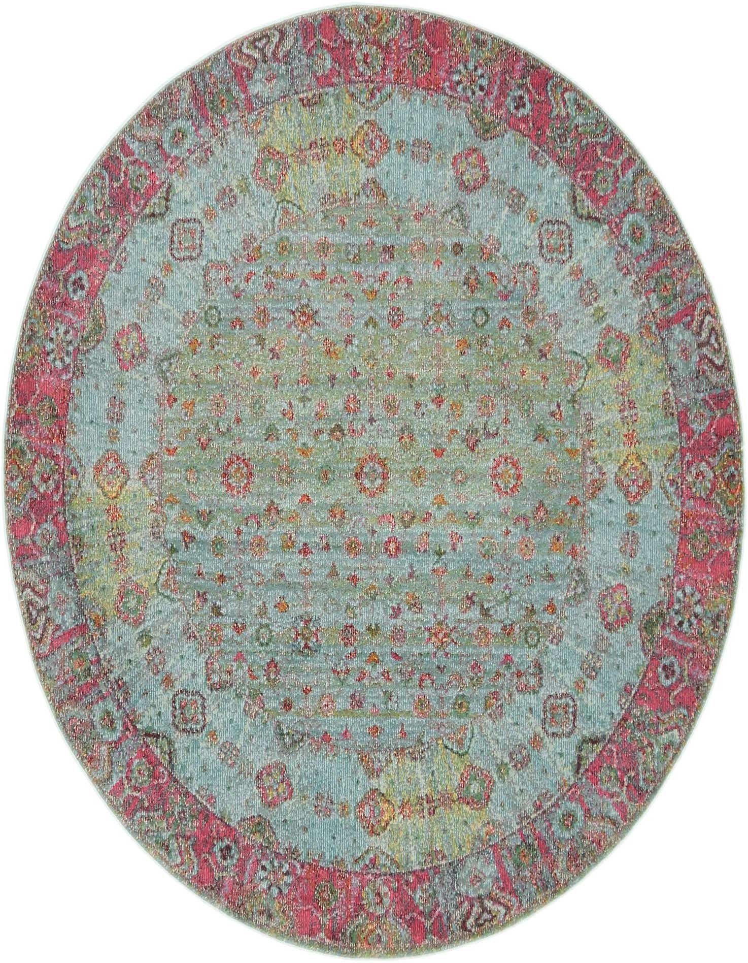 A 5' 5 round blue bohemian rug with a distressed floral pattern and a vibrant pink border.